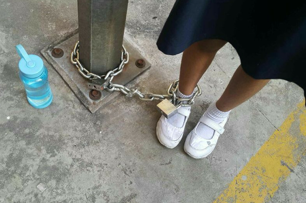 schoolgirl-chained-pole-fb.png