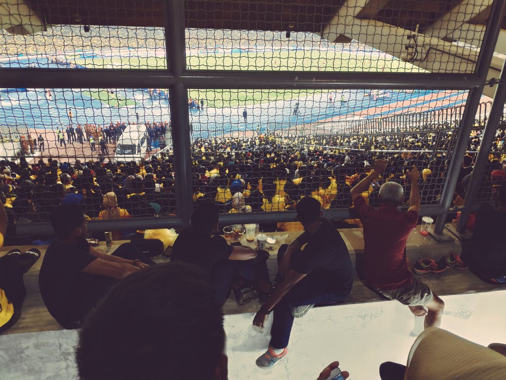 In between fences, gates, anything to get a glimpse of the match.