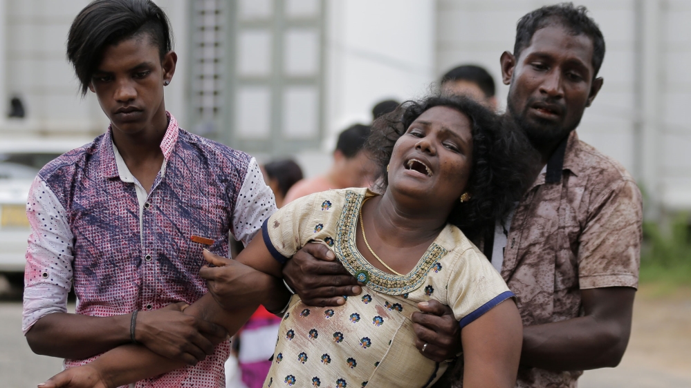Victim's relatives outside a morgue in Colombo.