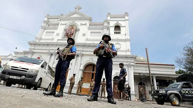 Sri Lankan military officials guarding the front of the St Anthony's Shrine.