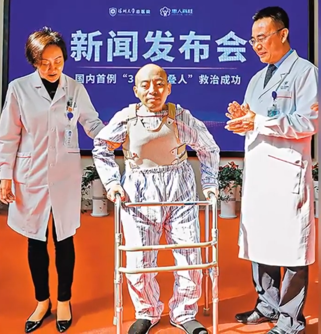 Li is able to move around with a walker.