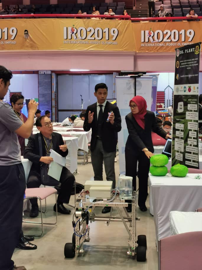 Ahmad Muqry and Nur Ain Balqis showing their hard work.