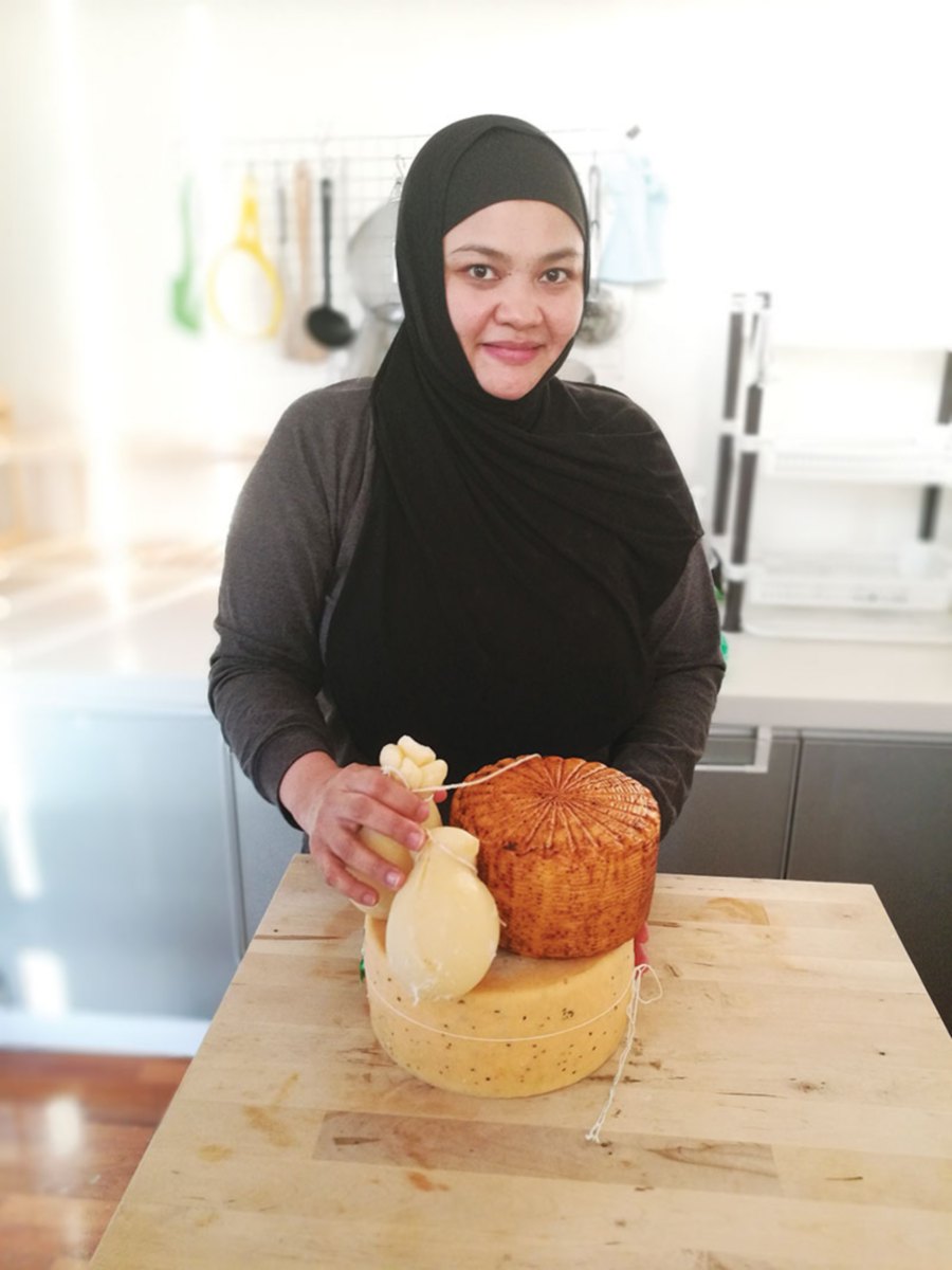 The girl behind the cheese.