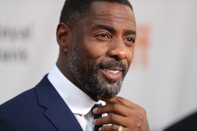He looks good in a suit.