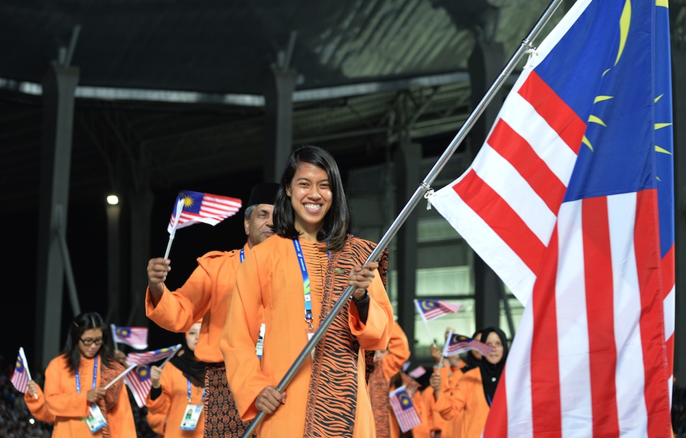 MANAN VATSYAYANA/AFP Nicol leading the Malaysian contingent during the opening ceremony of the 2014 Asian Games.