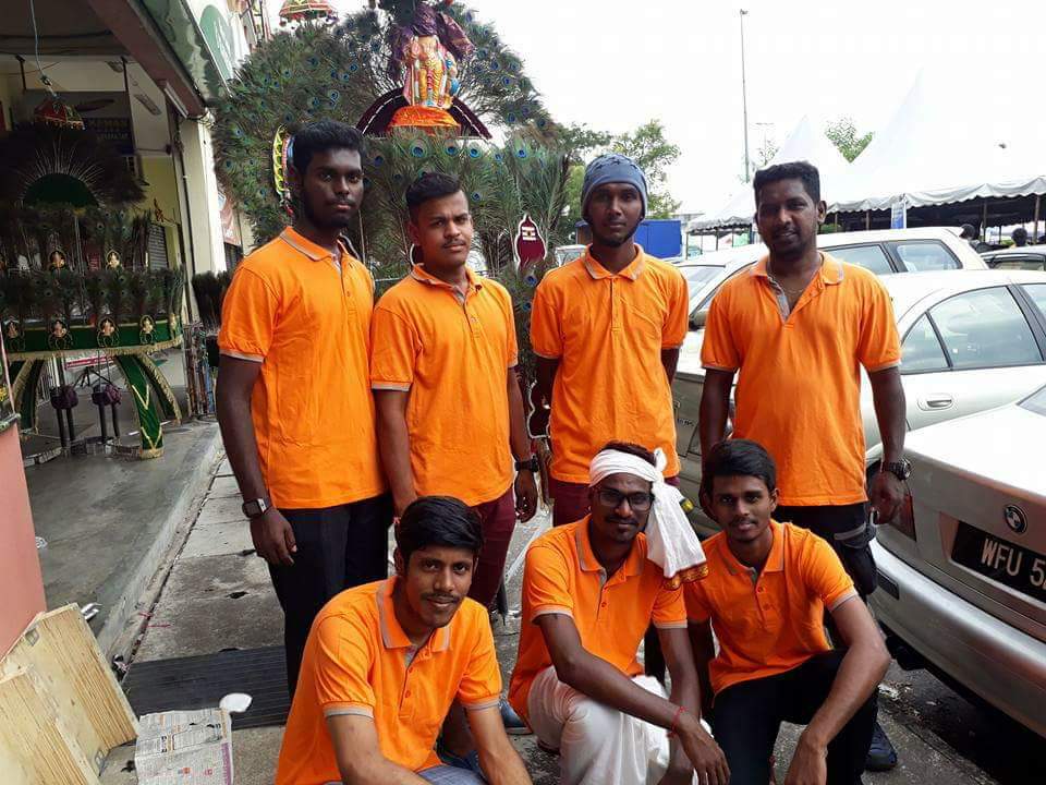 Saravanan (standing, far right) and his team.