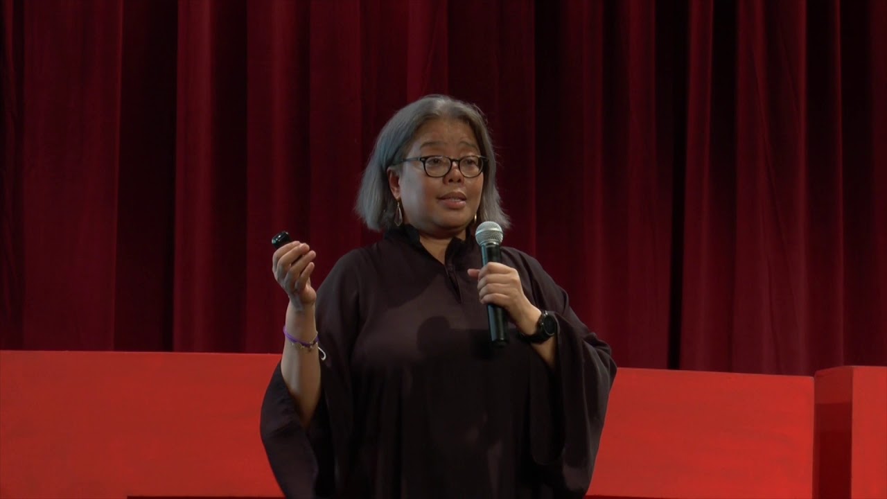 Miaqai Sarah Dr. Hartini giving a TEDTalk on child trafficking.