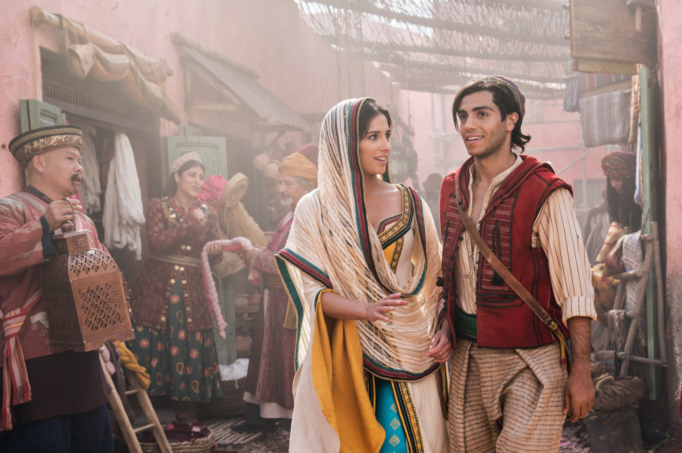 Naomi Scott as Princess Jasmine and Mena Massoud as Aladdin.