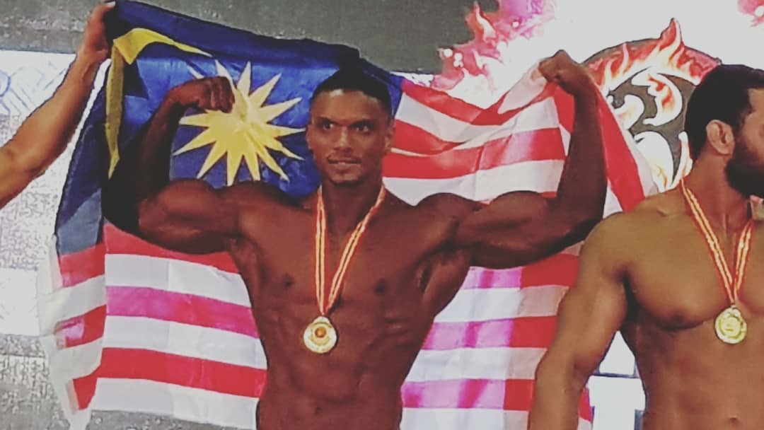 Yuvaraaj Ravintharan Showing off his guns.