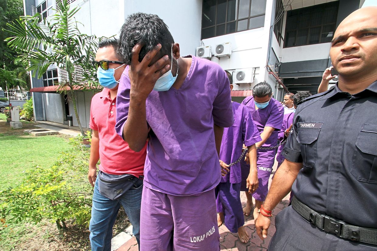 Sugu being brought to the Magistrate's Court in Ipoh.