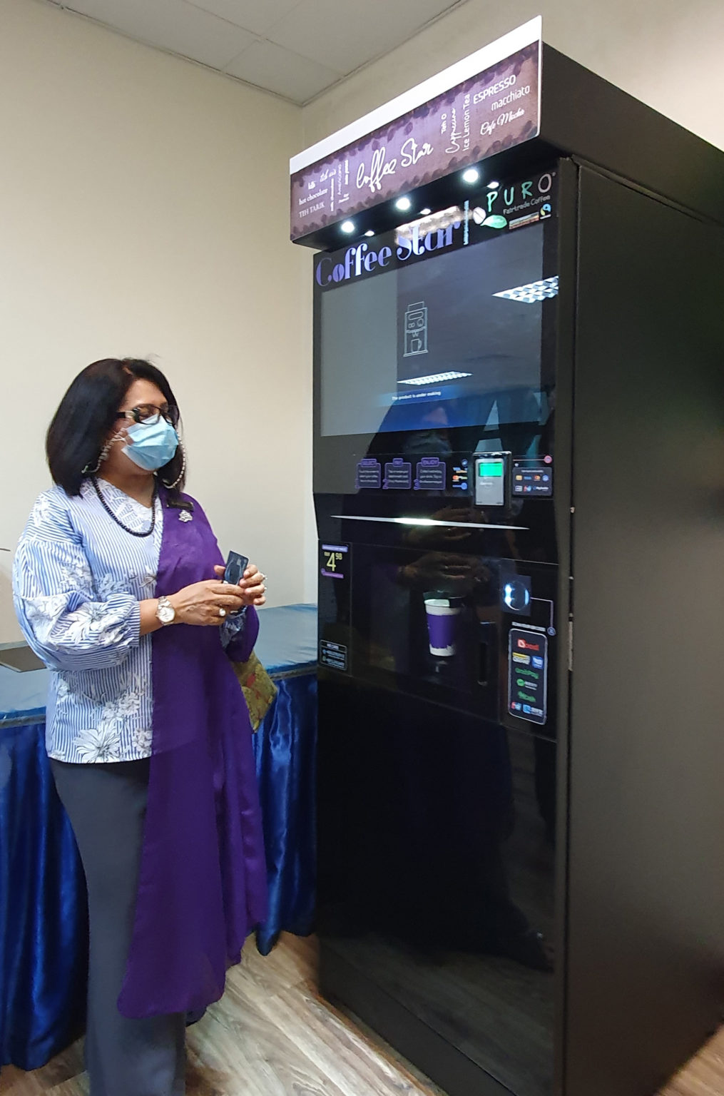 Sungai Buloh Hospital Director Dr Kuldip Kaur Trying the Coffee ATM Machine