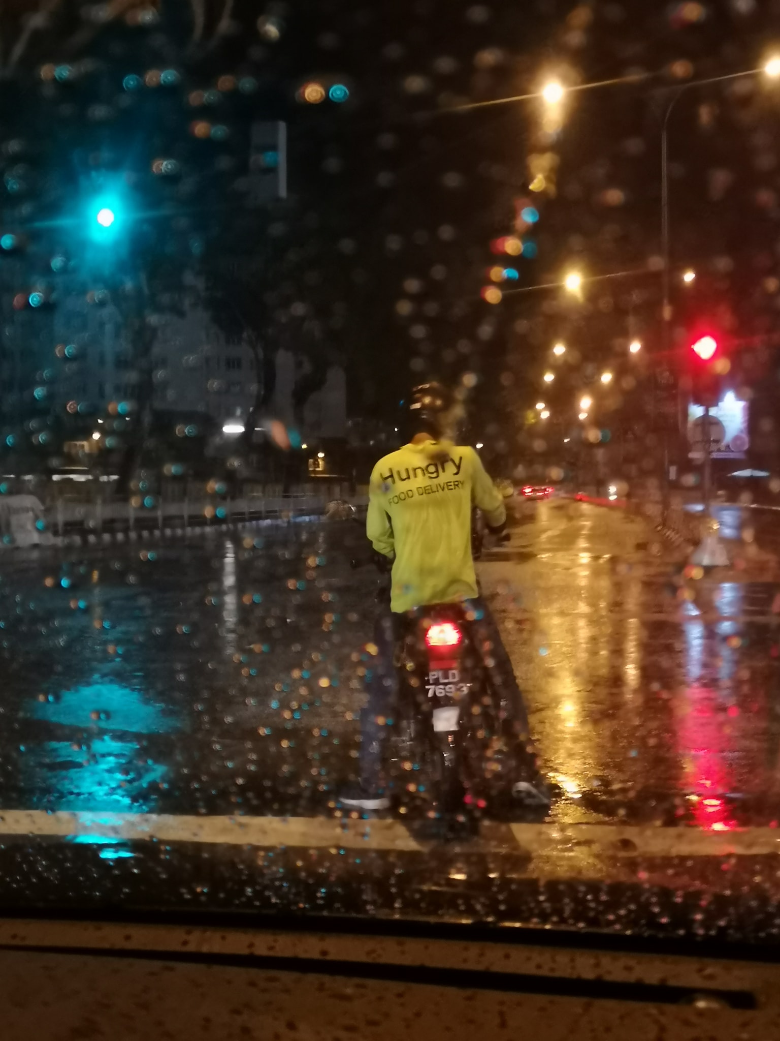 The poor rider was stuck in the rain.