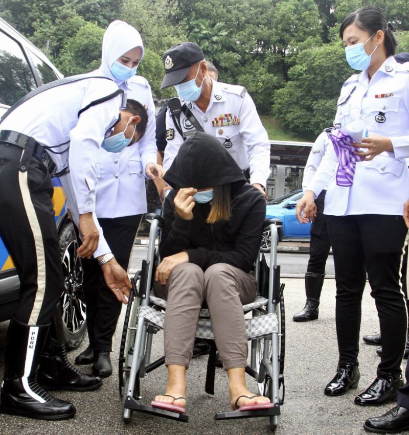 The suspect being brought to court.