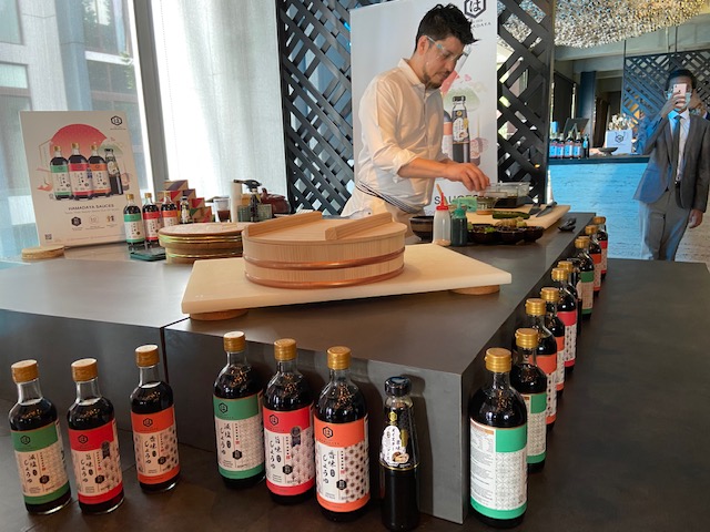 Jeff Ramsey showing the guests how Hamadaya Sauces can be incorporated in Japanese cooking