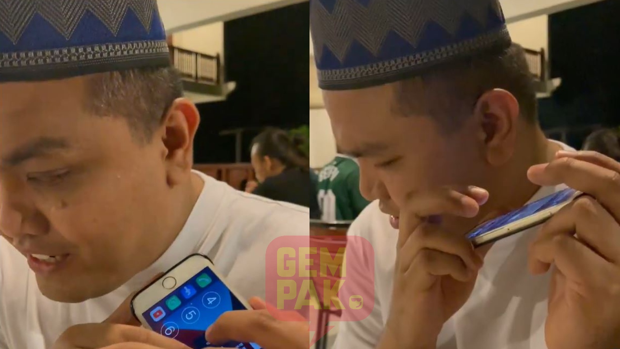 danial-zaini-azmi-saat-oku-guna-phone.jpg